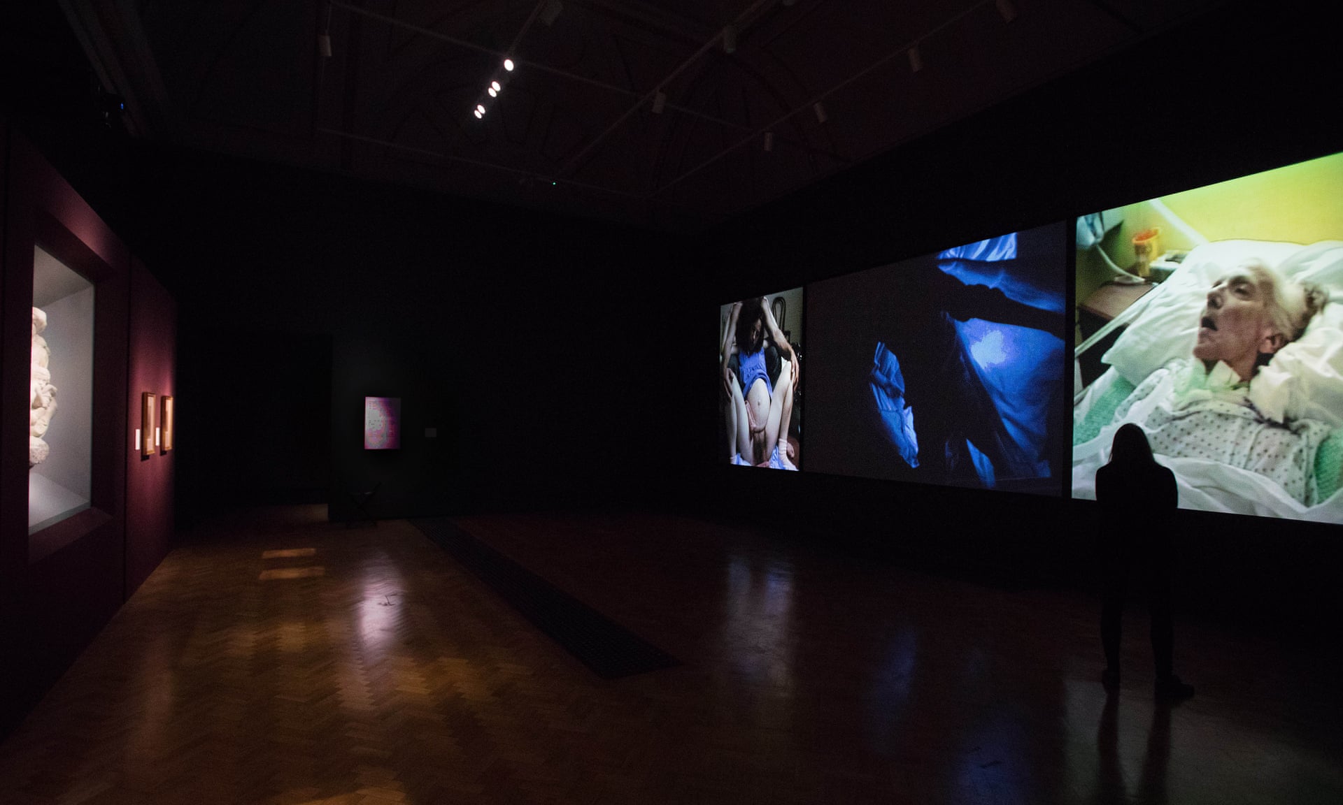 Bill Viola’s Nantes Triptych, 1992, right, opposite Michelangelo’s Taddei Tondo at the Royal Academy. Photograph: David Parry © Royal Academy of Arts