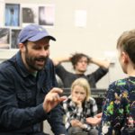 Matthew Bulgo (Bob Cratchit, Fezziwig, Richard, Schoolmaster) (L) and Lewis Lowry (Tiny Tim) (R) A Christmas Carol Rehearsals Theatr Clwyd 2019