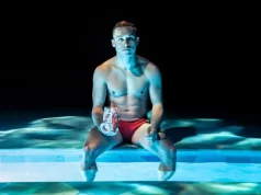 Finn Cole in Red Speedo, © Johan Persson